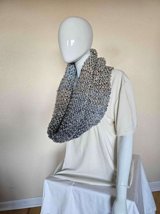 Outlander-inspired chunky knit cowl in scrumptiously soft , easy care acrylic yarn. Soft tans and blues. Hand knit infinity scarf, 13.5 x 38 inches. Shown worn as infinity scarf with cowl neckline.