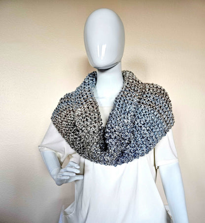 Outlander-inspired chunky knit cowl in scrumptiously soft , easy care acrylic yarn. Soft tans and blues. Hand knit infinity scarf, 13.5 x 38 inches. Shown worn as shoulder warmer with cowl neckline from the front.